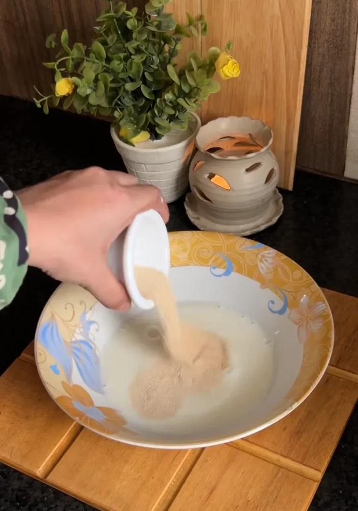Yeast and sugar stirred into lukewarm milk until frothy