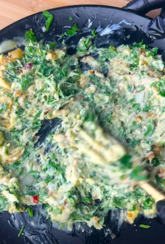 The finished garlic herb butter, mixed and green-flecked