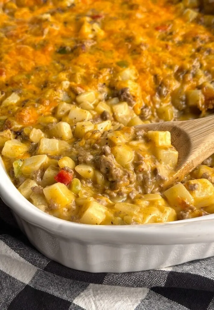 Baked cheesy ground beef and potato casserole with a golden melted cheese top