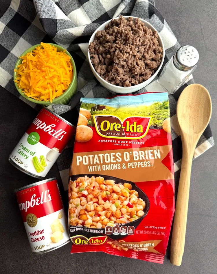 Ingredients for cheesy ground beef and potato casserole — frozen Potatoes O'Brien, ground beef, cream of celery soup, cheddar cheese soup and shredded cheddar
