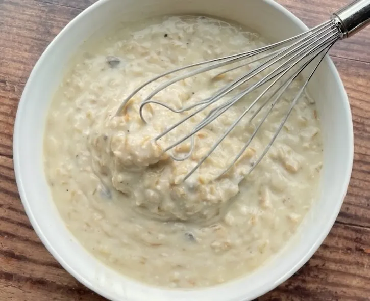 Cream of chicken and mushroom soup whisked with onion soup mix into a creamy sauce