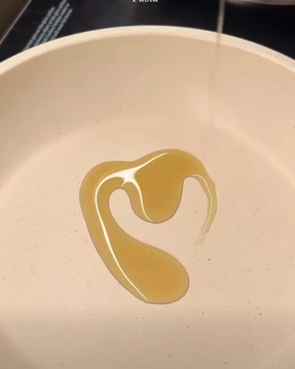 Butter and oil melting together in a pan to start the garlic parmesan pasta