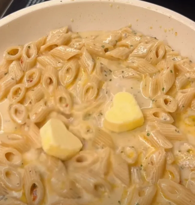 Cream and a knob of butter stirred into the cooked penne